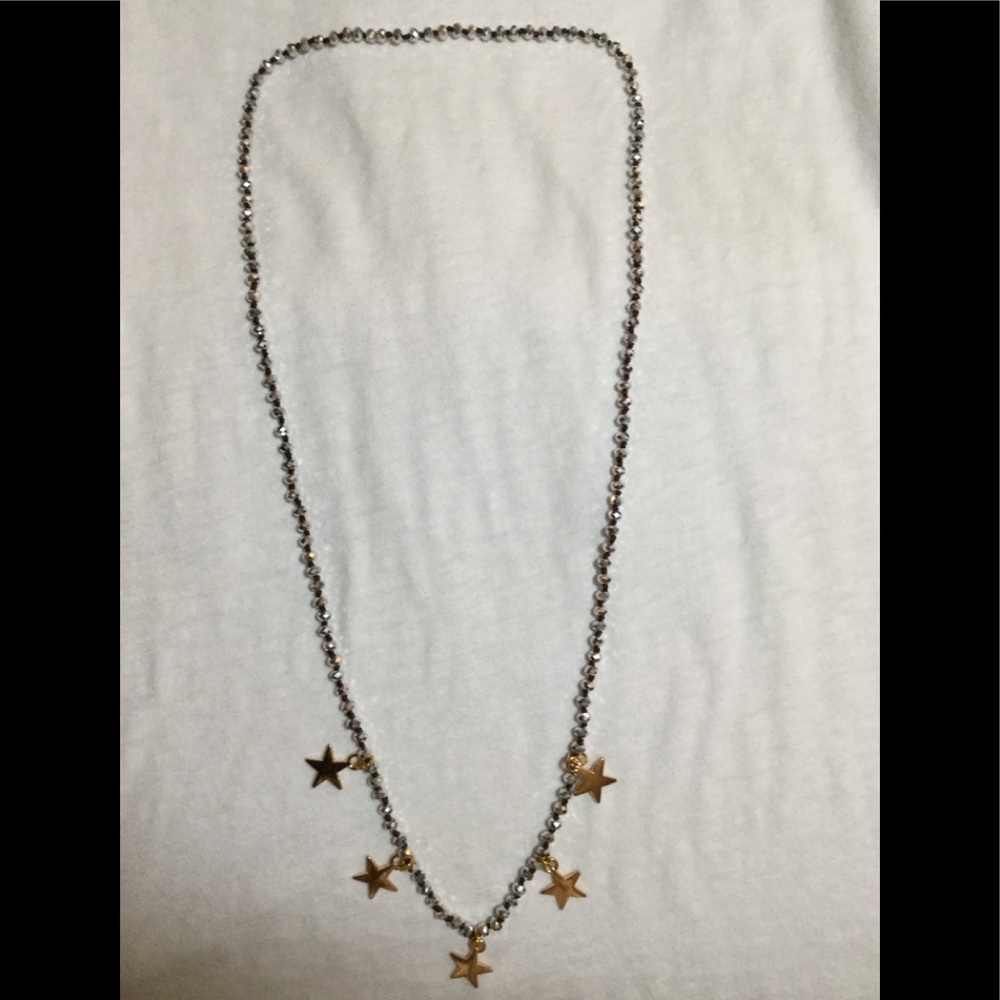 Necklace -silver beads with gold stars.